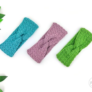 May include: Three handmade crochet headbands in teal, lavender, and green. Each headband features a twisted knot design. The headbands are displayed on a white surface, with green leaves in the upper left corner. The headbands are a stylish accessory.