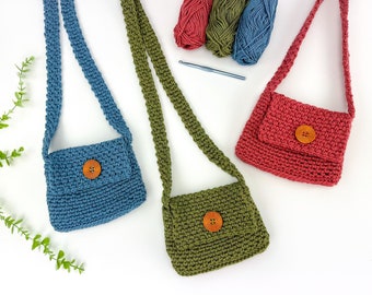 May include: Three crocheted mini bags with adjustable straps and button closures. The bags are in blue, green, and red.