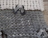 Grey and white pom pom blanket