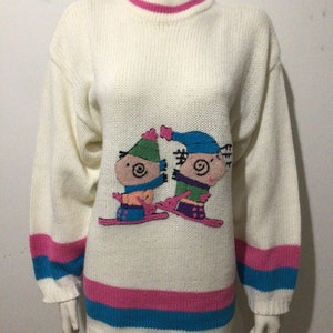 Vintage woman’s sweater, cute appliqué characters on skis. 80s, acrylics.