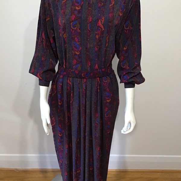 Vintage 90s pleated dress. Wonderful deep rich colours. Belt, pockets and buttoned cuff.