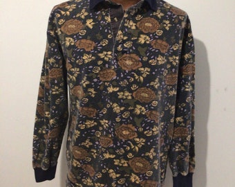 Vintage 1980s men’s long sleeve polo floral shirt. Navy collar, cotton, finished bottom hem.