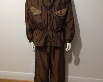 Vintage 80’s 2 pc. Warm up, leisure, track suit. Shoulder pads, brown, elastic pants. Lined.