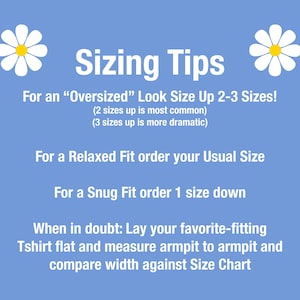 May include: A light blue graphic with white text providing sizing tips for t-shirts. The text advises on sizing for oversized, relaxed, and snug fits, and includes a tip for measuring a favorite shirt for comparison.