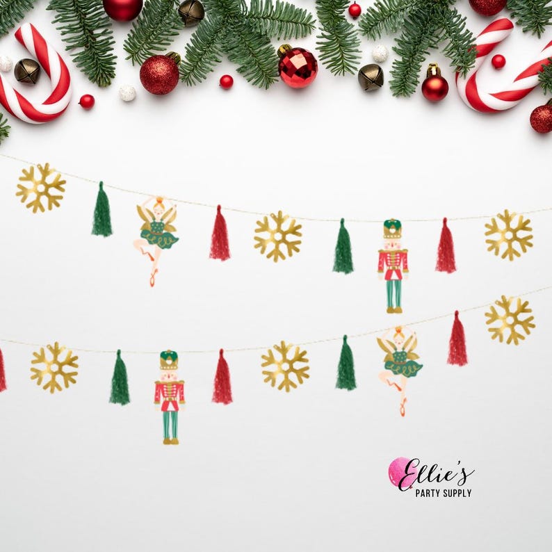 May include: A festive Christmas garland with gold snowflake cutouts, green tassel accents, and decorative figures of a ballerina and a nutcracker. The garland is strung with a gold string and is decorated with Christmas ornaments.
