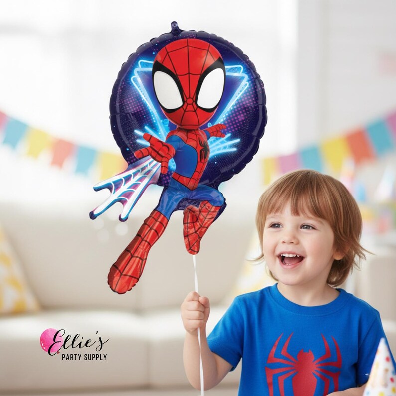 May include: A round foil balloon featuring a cartoon Spider-Man character in a red and blue suit with a web-shooting pose. The background of the balloon is dark blue with neon light accents. The balloon is attached to a white ribbon string.