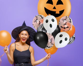May include: A woman wearing a witch hat holds a bunch of Halloween-themed balloons. The balloons are orange, black, and white with various designs, including ghosts, bats, and pumpkins.