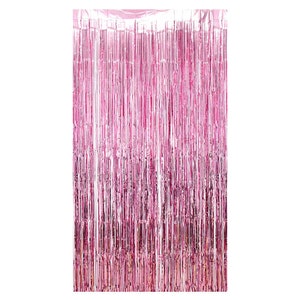 May include: A pink metallic fringe curtain. The curtain is made of long, vertical strips of shiny material, creating a shimmering effect. The colour is a vibrant, medium pink, suitable for party decorations or photo backdrops.