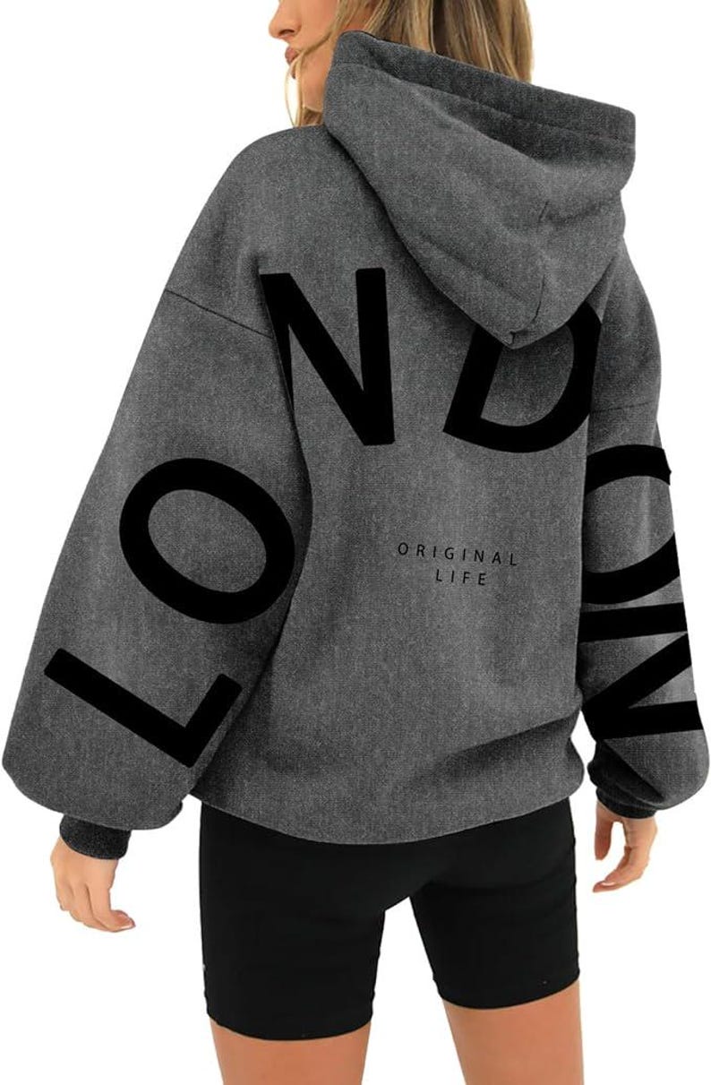 May include: Gray hooded sweatshirt with the word "LONDON" printed in black on the back. The text "ORIGINAL LIFE" is printed in smaller letters below the word "LONDON".