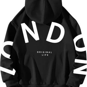 May include: Black hooded sweatshirt with white lettering that says "LONDON" on the front and "ORIGINAL LIFE" on the back.