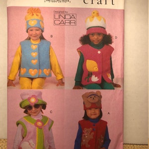 May include: A sewing pattern for four children's costumes. The pattern includes a bear, bunny, chick, and heart design. The pattern is from Vogue Crafts and designed by Linda Carr.
