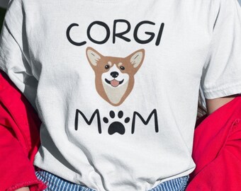 May include: White t-shirt with the text "Corgi Mom" and a cartoon image of a corgi dog.
