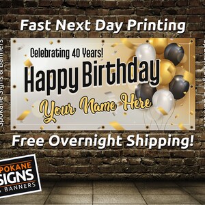 May include: A white banner with gold and black balloons and confetti. The banner says "Celebrating 40 Years! Happy Birthday Your Name Here".