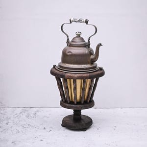Antique 19th century copper kettle with stove and porcelain handle.
