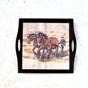 Antique tray tiles on a wooden window, 1960s. man plowing the field, vintage farmhouse style, antique wall decoration.