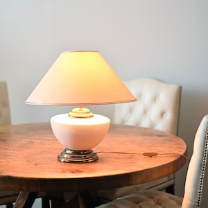 Vintage white ceramic lamp with shade. metal foot.