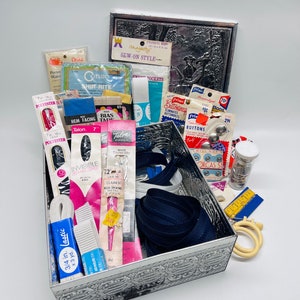 Lot of Vintage Sewing Notions in Vintage Repousse Embossed Tin “Le Monument du Costume”