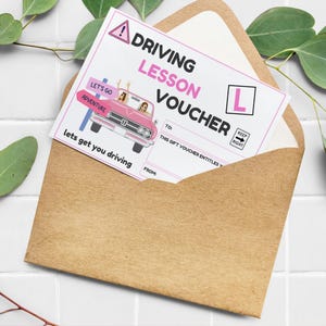 May include: A pink and white driving lesson voucher with a cartoon image of two women in a pink car. The voucher says "Let's go adventure" and "Lets get you driving".