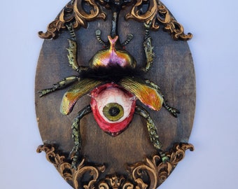 Peekaboo beetle wall hanging