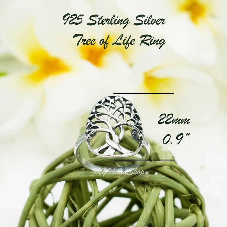 May include: A sterling silver Tree of Life ring. The ring has an openwork design of a tree with branches and roots. The ring is approximately 2.2 cm in length. The text "925 Sterling Silver Tree of Life Ring" is at the top.