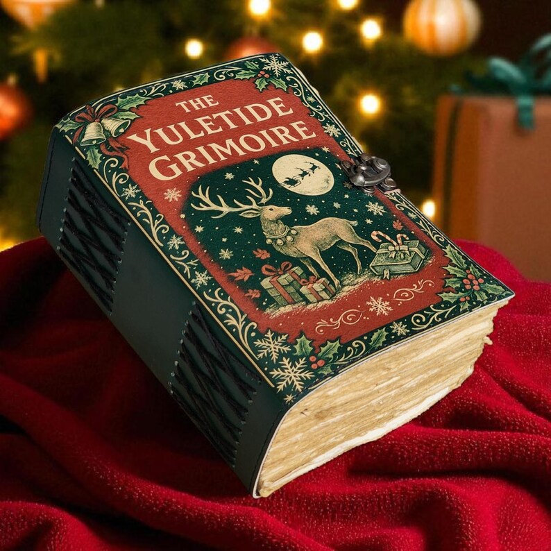 May include: A decorative book titled "The Yuletide Grimoire" with a festive design. The cover features a reindeer, gifts, and a full moon against a green background. The book is bound in dark green leather and rests on a red surface.