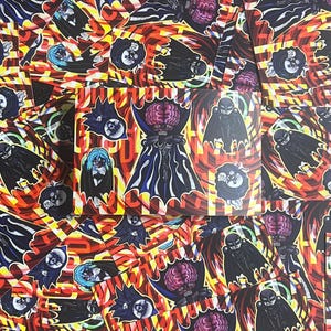 May include: A stack of colourful stickers featuring a repeated pattern of a black and white illustration of a creature with a brain for a head. The creature is wearing a cape and has a skull-like face. The background is a red, yellow and blue striped pattern.