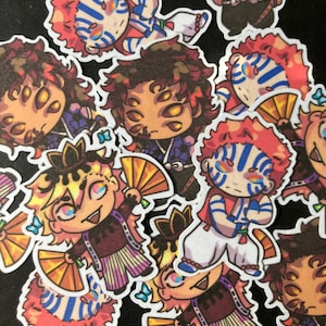 May include: A collection of colorful anime character stickers featuring various characters with different facial expressions and hairstyles. The stickers are printed on white paper and have a glossy finish.