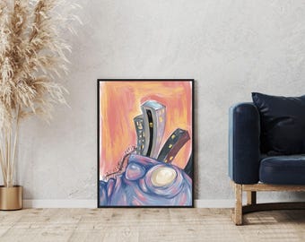 May include: Abstract cityscape art print in a black frame. The artwork features stylized buildings in shades of gray and brown against a vibrant orange and pink sky. The foreground has a blue and purple abstract shape.