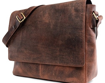 May include: A brown leather messenger bag with a flap closure and adjustable shoulder strap. The bag has a distressed look and a worn finish.