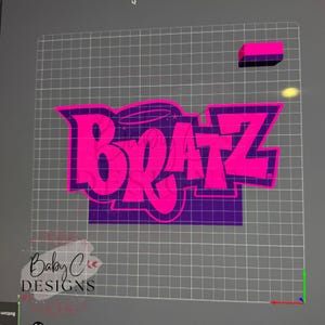 May include: A vibrant pink and purple graphic featuring the word "BRATZ" in a bold, stylized font. The design includes a halo and stars, with a purple background. The image also includes the text "Baby C DESIGNS".