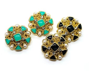 Metal, rhinestones, faux gold colored setting, pearl button, diamond button, green rhinestones, black rhinestones, shank style