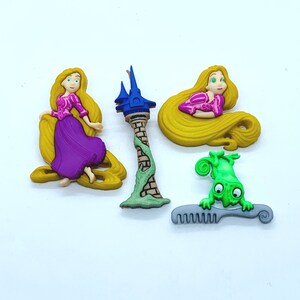 May include: A set of five colourful plastic figurines featuring a tower, a green chameleon, a comb, and two figures of a princess with long blonde hair.