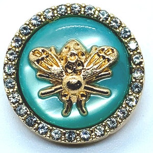 May include: A gold-toned bee charm with a turquoise enamel body and clear rhinestone accents around the edge.