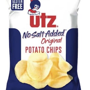 May include: A blue and white bag of Utz No Salt Added Original Potato Chips. The bag features a cartoon girl with a red bow and the text "Gluten Free". The bag contains 2.75 ounces (78 grams) of potato chips.