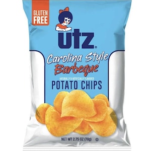 May include: A bag of Utz Carolina Style Barbeque potato chips. The bag is blue and white with a picture of a girl in a red dress. The bag says "Gluten Free" and "Net Wt 2.75 oz (78g)".