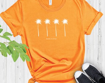Könnte beinhalten: Orangefarbenes T-Shirt mit einer weißen Grafik von vier Palmen und dem Text "Southern Collective".