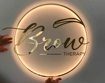 Letrero acrílico dorado con logotipo personalizado y retroiluminado: Decoración para salones y negocios