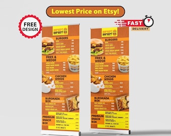 Op de afbeelding: Twee gele en oranje intrekbare bannerstandaards met een menu voor een hamburgerrestaurant genaamd "Burger! Burger!" Het menu bevat hamburgers, frietjes en wedges, kippenvleugels, een burgakada box en een premium snack box. De bannerstandaards staan op een witte achtergrond.