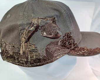 Dri Duck Excavator on a 6 panel structured 6 panel cap with curved visor and Velcro closure