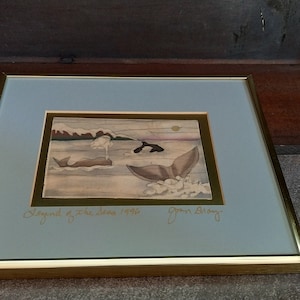 May include: Framed watercolour painting of a scene with two orcas swimming in the ocean. The painting is titled "Legend of the Sea" and signed "John Alley".