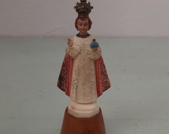 Child Jesus of Prague Plastic Figure on Wood Base
