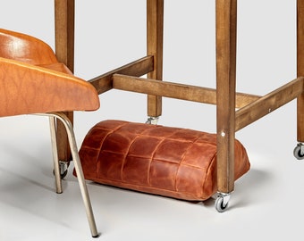 Ergonomic footrest leather accessory to any desk. Under desk foot rest for improved posture, and orthopedic relief