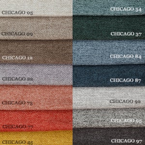 May include: A color palette of fabric swatches labeled "CHICAGO" with numbers. The swatches display a variety of colors, including beige, brown, blue, red, and gray. The fabric appears to have a textured weave.