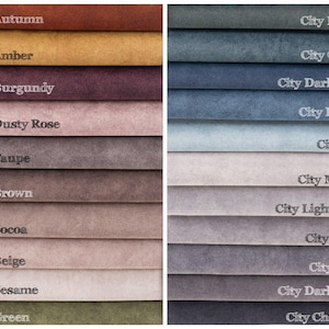 May include: A color swatch image featuring various fabric samples. The samples are arranged in rows and columns, showcasing a range of colors including Autumn, Amber, Burgundy, Dusty Rose, Taupe, Brown, Cocoa, Beige, Sesame, and Green.
