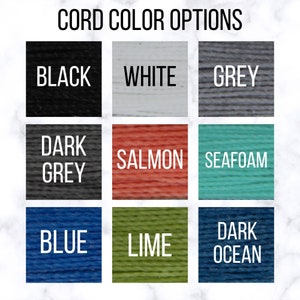 May include: Cord color options for a product. The colors are black, white, grey, dark grey, salmon, seafoam, blue, lime, and dark ocean.
