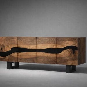 May include: A wooden sideboard with a dark, flowing, river-like design across the front. The cabinet is made of natural wood with a dark stain and sits on four black metal legs. The doors are flush and seamless.