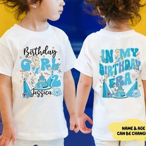 two children wearing white t-shirts with personalized text and illustrations related to a birthday celebration.