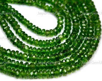 May include: Strands of faceted, deep green gemstone beads. The beads are strung together, creating multiple rows of the same material. The beads are a vibrant, rich green color. The text "JaipurGemUS" is visible in the image.