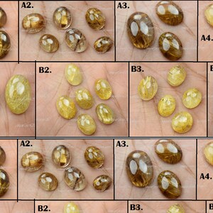 May include: An assortment of golden rutile quartz cabochons in various sizes and shapes. The stones have a translucent appearance with golden needle-like inclusions. Some are oval, others are round.