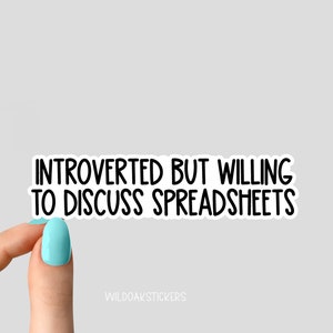 May include: White sticker with black text that reads "Introverted but willing to discuss spreadsheets".